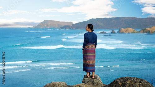 Young woman enjoying seascape on Merese hill photo