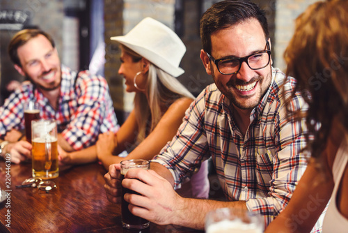 Photography Happy friends having fun at bar - Young trendy people drinking beer and laughing
