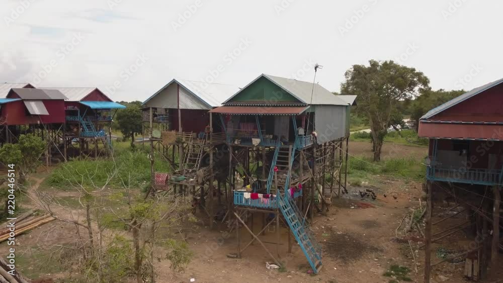 Aerial parallax shot of houses on stilts in the traditional village of Kampong Phluk in rural Cambodia Aerial parallax shot of houses on stilts in the traditional village of Kampong Phluk in rural Cambodia