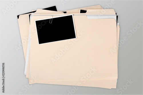 Naklejka Manila folder with some documents in it. on background