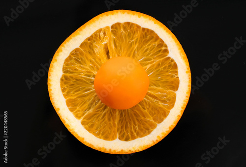 Orange candy on the orange circle photo