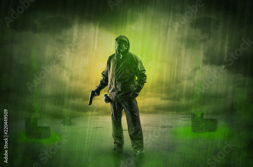 Masked unrecognizable guard in an abandoned space after explosion
