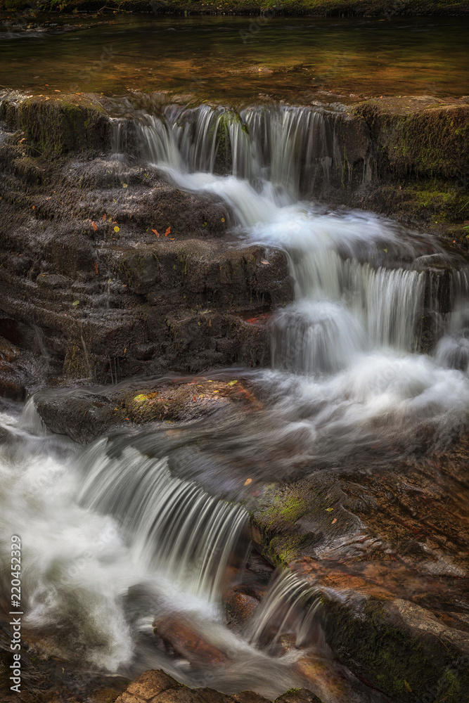A section of the waterfall known as Sgwd y Pannwr in Waterfall Country, South Wales, UK
 - obrazy, fototapety, plakaty 