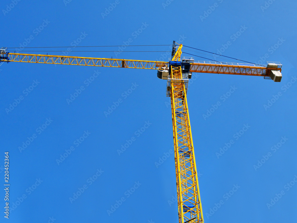 Crane. Tower crane against blue sky. Construction crane. Crane. Tower crane against blue sky. Construction crane.