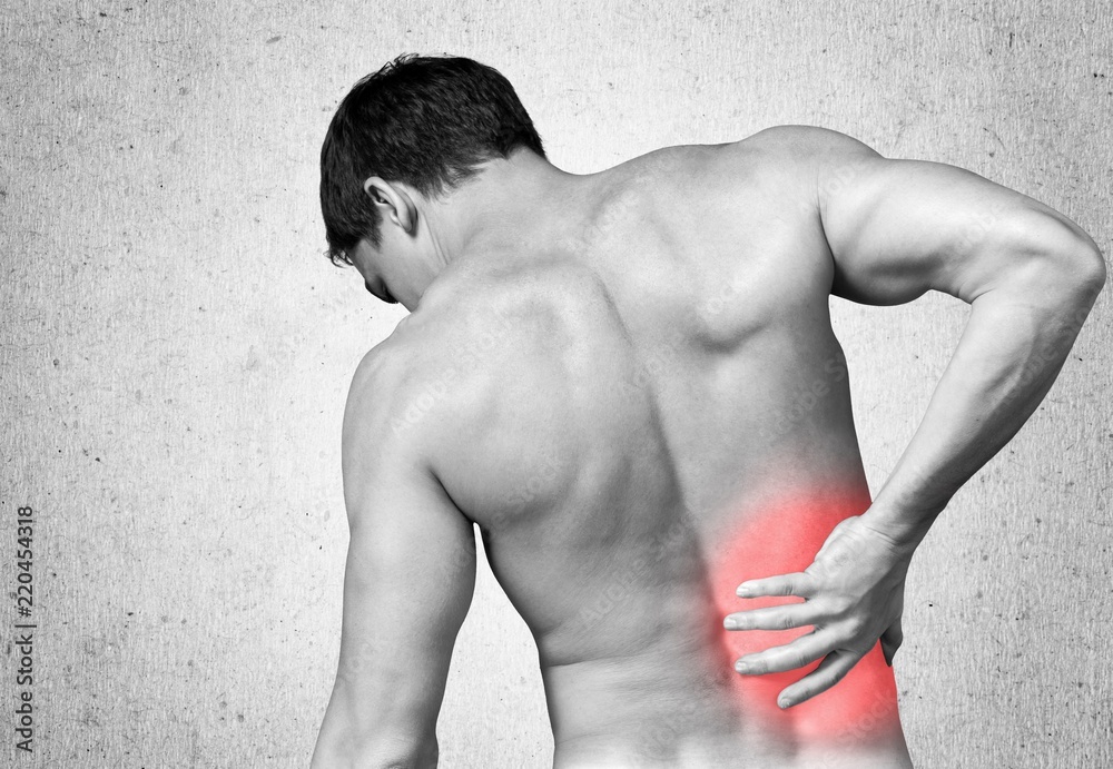 Back view of shirtless man touching his aching back Stock Photo | Adobe ...