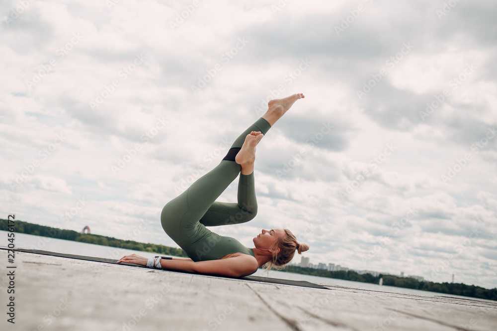 Fototapeta premium Young woman doing yoga practice