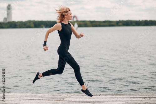 Young sporty woman running