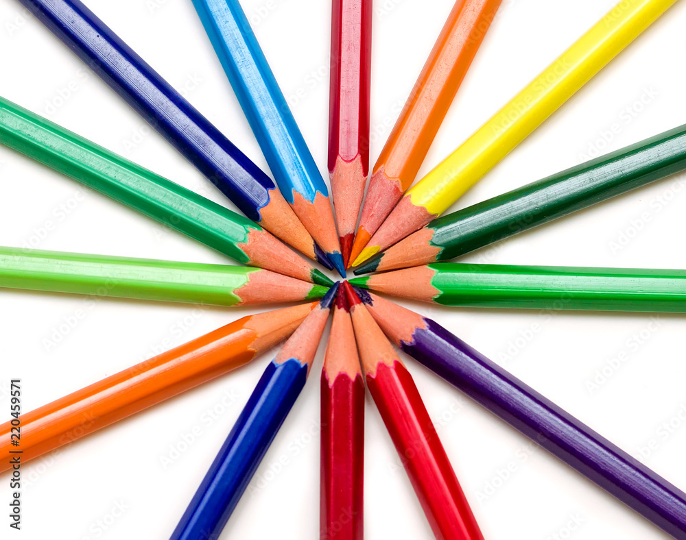 Colored pencils on a white background. Colored pencils on a white background.