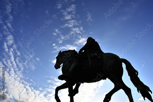 Monument of a man on a horse in Berlin Germany on a warm and sunny day.