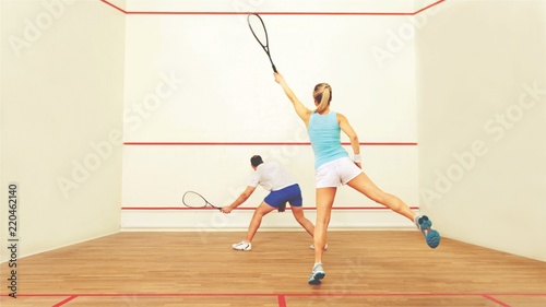 Couple people playing squash