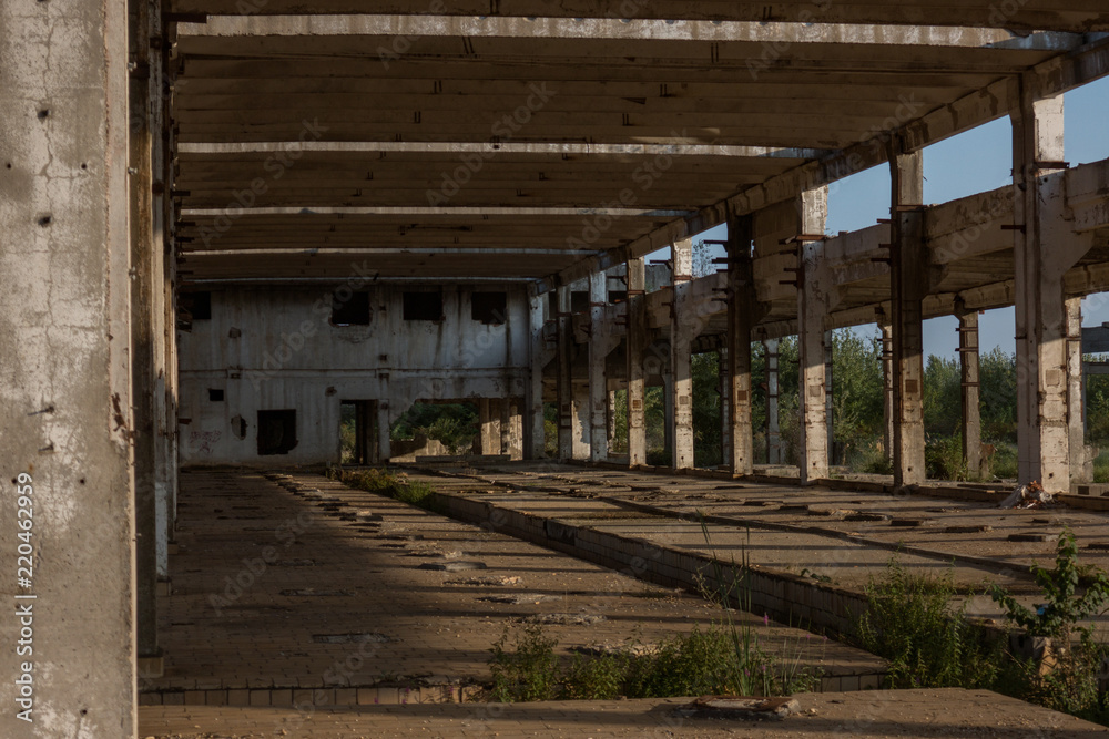A deserted industrial plant site with old deserted structure on a beautiful sunset. A deserted industrial plant site with old deserted structure on a beautiful sunset.