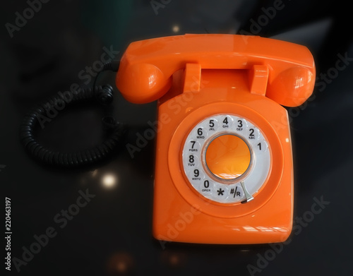 Fotografie Old Fashioned Orange Vintage Rotary Dial Telephone