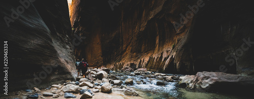 Two Young Female Friends Hiking Through the Narrows, Zion National Park, Utah - USA