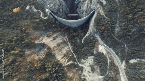 Drone Aerial Top View of the Vajont Dam in Italy, Slow Motion Top View of the Forest Valley with Rocks and Waterfalls photo