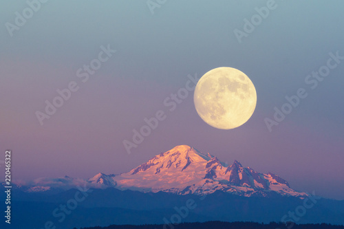 Mountain Baker and full moon with sunset sky backgrounds