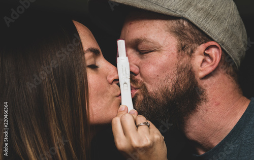 Young couple finding out that they're having a baby.