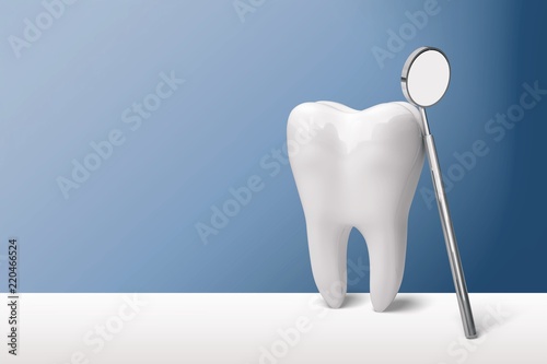 Big tooth and dentist mirror in dentist clinic on background photo