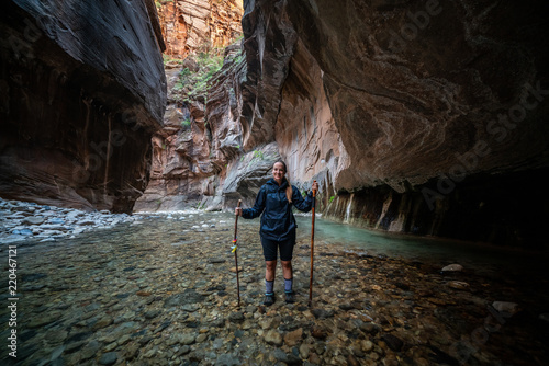 Young Female Hiking Through the Narrows, Zion National Park - USA
