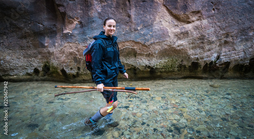 Young Female Hiking Through the Narrows, Zion National Park - USA