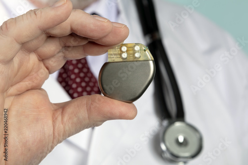 Male Hand hold Pacemaker photo