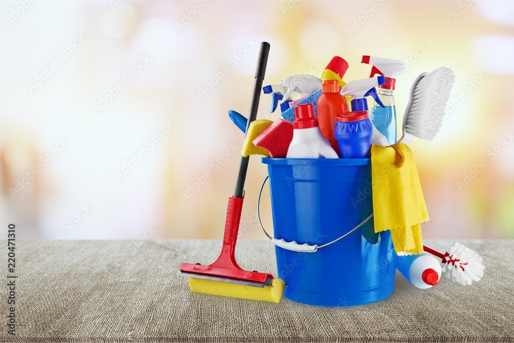 Plastic bottles, cleaning sponges and gloves on blue background Plastic bottles, cleaning sponges and gloves on blue background