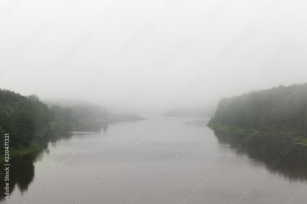 Fototapeta premium river in cloudy foggy weather