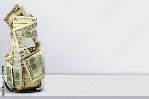 Glass jar for money  on background photo