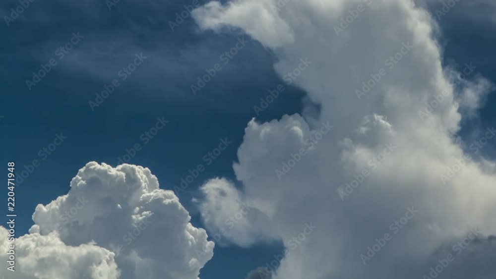 Puffy clouds moving in the blue sky time lapse in 4k Puffy clouds moving in the blue sky time lapse in 4k