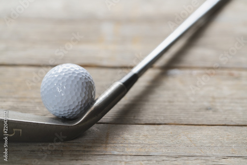 golf ball and golf club on the table background