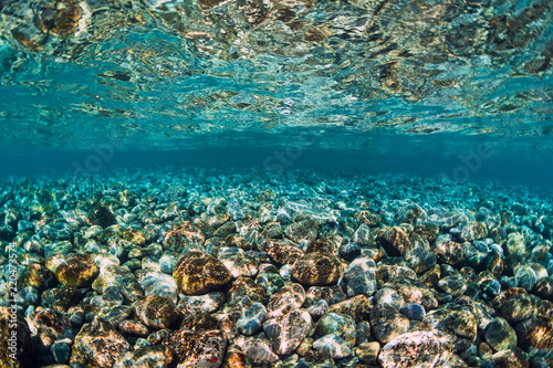 Underwater scene with stones, copy space.