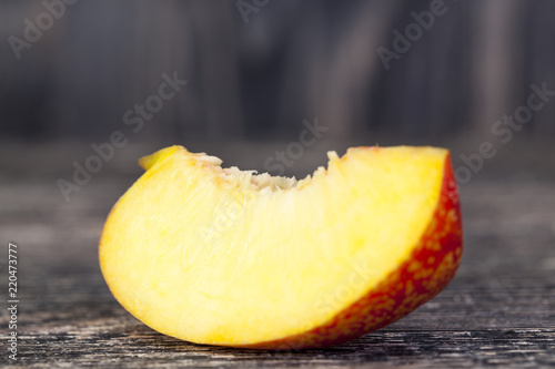 one fresh slice of ripe peach