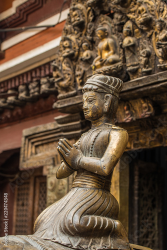 The ancient bronze statue sitting in front of Golden Temple (Kwa Bahal) in Patan, Nepal.
