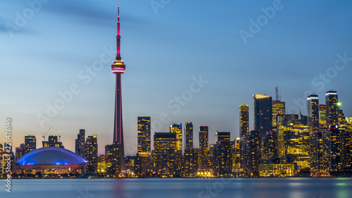 Long exposure of Toronto, Ontario - Canada. Bright sky with a smooth water surface. Beautiful city lights seen from the Toronto Island