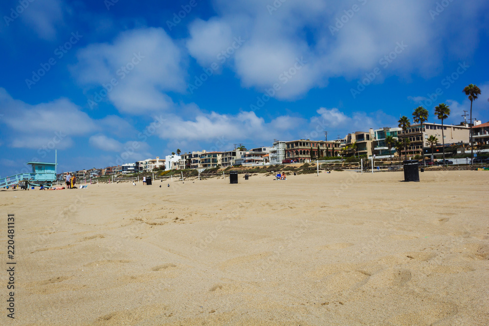 Sandy Manhattan beach with palms and mansions in Los Angeles