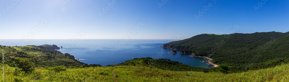 Panoramic view of the bay and green hills in far east of Russia