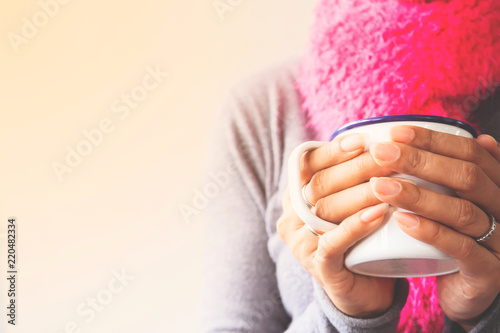Woman hands holding a mug of coffee or tea, Toned picture