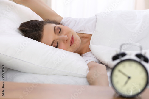Wallpaper Mural Beautiful young woman sleeping while lying in her bed. Concept of pleasant and rest reinstatement for active life Torontodigital.ca