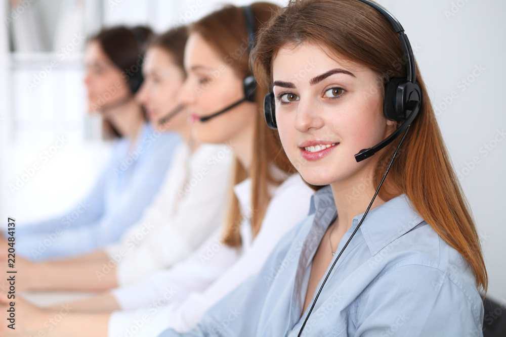 Call center. Beautiful cheerful smiling operator consulting clients with headset. Business concept of customer service Call center. Beautiful cheerful smiling operator consulting clients with headset. Business concept of customer service