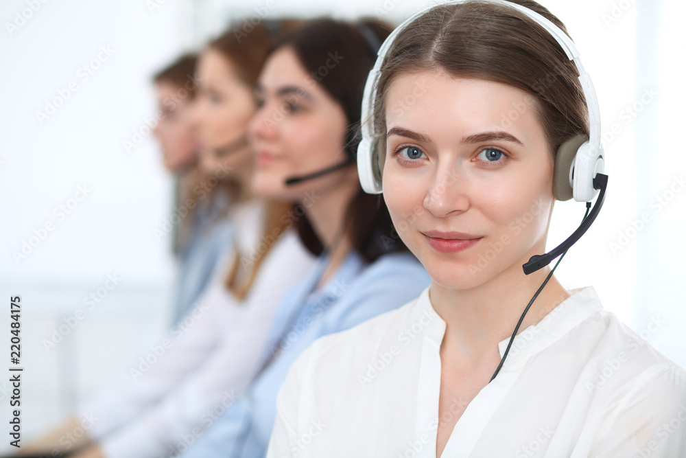 Call center. Beautiful cheerful smiling operator consulting clients with headset. Business concept of customer service Call center. Beautiful cheerful smiling operator consulting clients with headset. Business concept of customer service