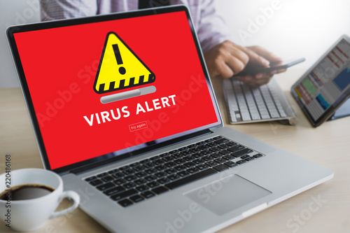 Fototapeta Naklejka Na Ścianę i Meble -  Hacker Protection Concept Man working on laptop Virus Detected Alert Digital Browsing Firewall