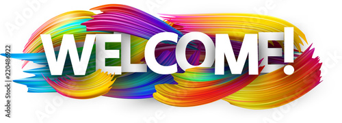Welcome paper banner with colorful brush strokes.