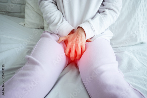 woman have bladder pain sitting on bed in bedroom after wake up feeling so sick and painful,Healthcare concept