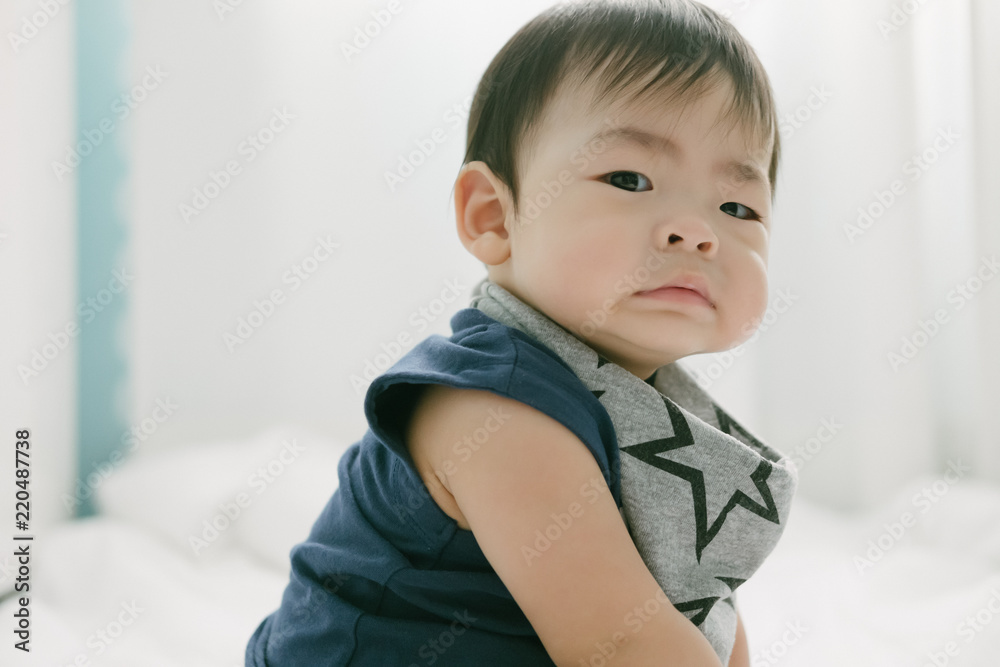 Portrait of a baby on the bed. Happy and fun. Portrait of a baby on the bed. Happy and fun.