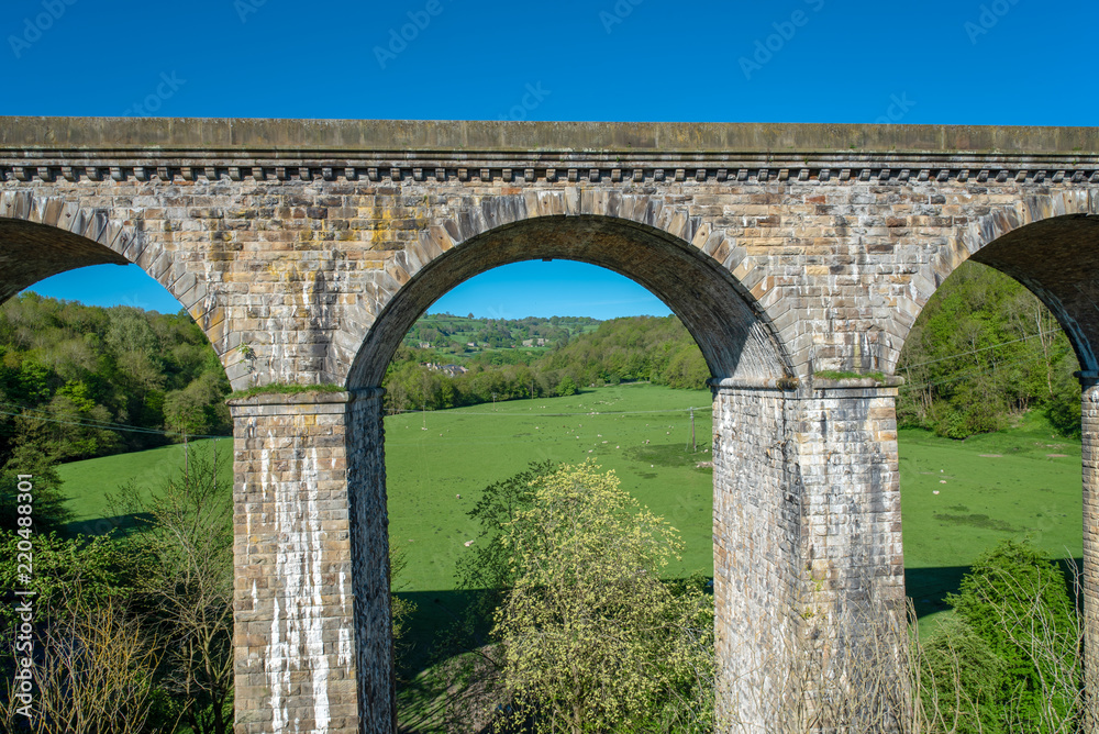 View of the Chirk railway viaduct from a narrowboat on the Chirk Aquaduct. The later built Railway viaduct runs alongside the navigable aquaduct.
