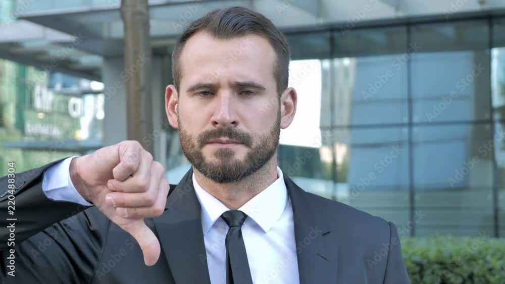 Thumbs Down by Beard Businessman Outside Office Thumbs Down by Beard Businessman Outside Office