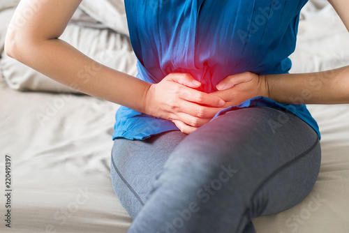 Woman having painful stomachache,Period cramps photo