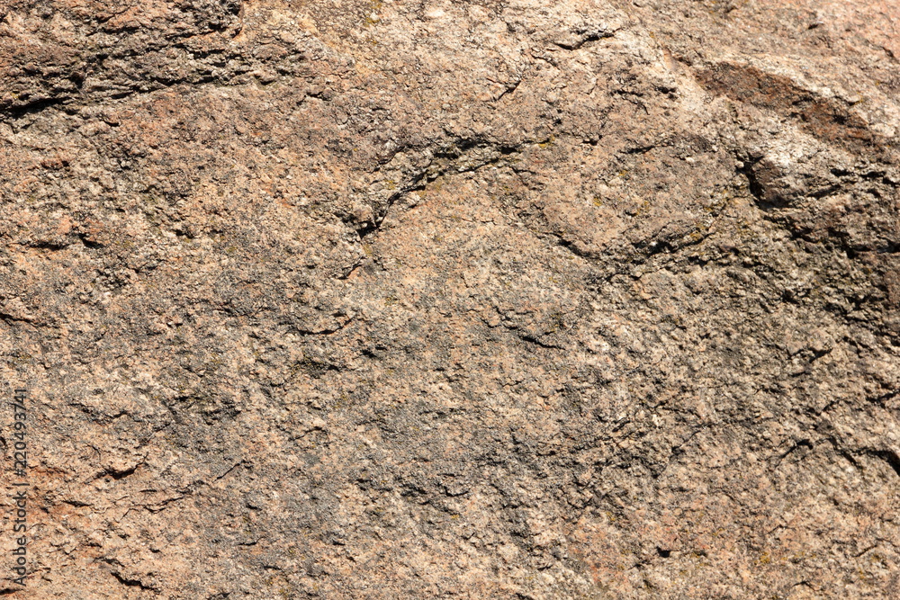 Granite background. Granite stone close up. Texture of natural material. Rocky rocks of ancient times. Natural pattern Granite background. Granite stone close up. Texture of natural material. Rocky rocks of ancient times. Natural pattern