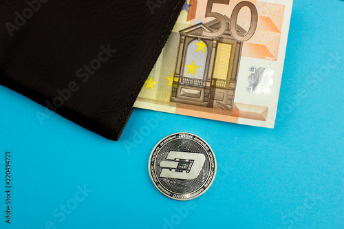 Cryptocurrency dashcoin and euro banknote. Blockchain technology. Virtual Digital money.  photo