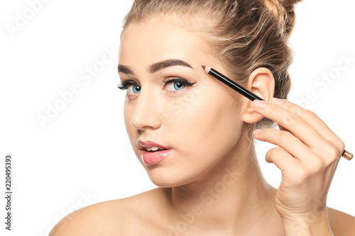 Young woman correcting shap...
