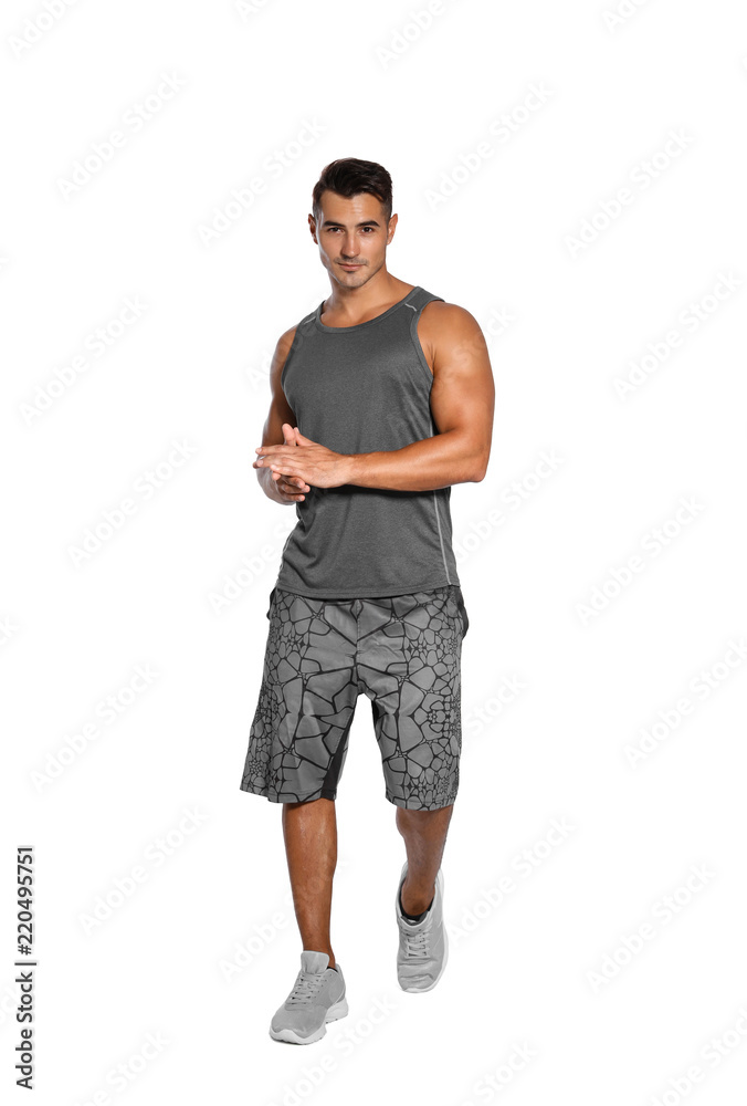 Handsome young runner posing on white background Handsome young runner posing on white background